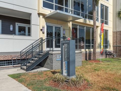 the front of a building with a sign in front of it